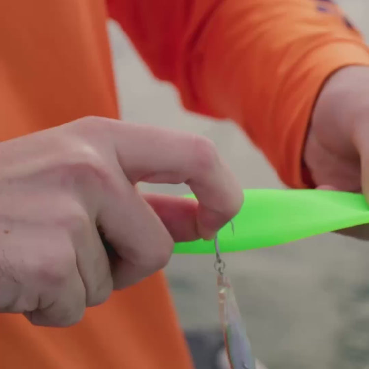 Video: an angler slides a Rod Armour rod sleeve over a rigged spinning rod with the lure still on